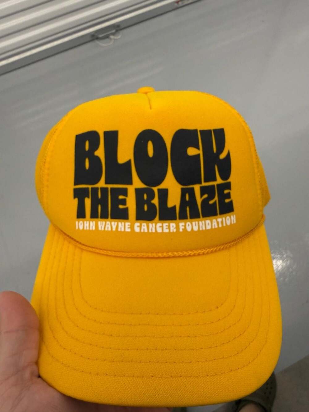 John Wayne Cancer Foundation Block the Blaze Trucker Hat Yellow